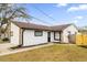 Newly painted house exterior with well-maintained lawn at 2762 Hilda Cv, Winter Park, FL 32792