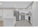 Modern kitchen with stainless steel appliances and white cabinets at 2762 Hilda Cv, Winter Park, FL 32792