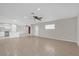 Open living room with kitchen access and tile flooring at 2762 Hilda Cv, Winter Park, FL 32792