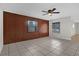 Bright living room with wood wall accents and tile floors at 2762 Hilda Cv, Winter Park, FL 32792