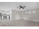 Open living room with kitchen views and tile floors at 2762 Hilda Cv, Winter Park, FL 32792