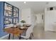 Modern dining room with a wood table and statement wall art at 2921 Hudson Hammock Way, Saint Cloud, FL 34773