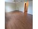 Large bedroom with wood-look laminate flooring and ceiling fan at 4530 Brook Hollow Cir, Winter Springs, FL 32708