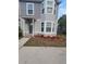 Two-story house with gray siding, landscaping, and a front entrance at 4530 Brook Hollow Cir, Winter Springs, FL 32708