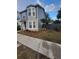 Two-story house with gray siding, landscaping, and a front entrance at 4530 Brook Hollow Cir, Winter Springs, FL 32708