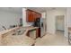 Kitchen boasts granite countertops, wood cabinets, and stainless steel appliances at 533 Arena Dr, Davenport, FL 33837