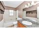Bathroom features granite countertop and updated vanity at 5724 Se 2Nd St, Ocala, FL 34480