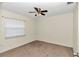 Bedroom with ceiling fan and carpet flooring at 5724 Se 2Nd St, Ocala, FL 34480