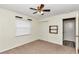 Bedroom with ceiling fan and carpet flooring at 5724 Se 2Nd St, Ocala, FL 34480