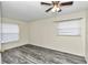 Bright bedroom with ceiling fan and wood-look floors at 5724 Se 2Nd St, Ocala, FL 34480