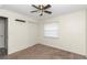Bedroom with ceiling fan and carpet flooring at 5724 Se 2Nd St, Ocala, FL 34480