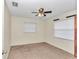 Bedroom with ceiling fan and carpet flooring at 5724 Se 2Nd St, Ocala, FL 34480