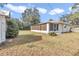 Back exterior view showing house, shed, and yard at 5724 Se 2Nd St, Ocala, FL 34480