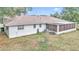 Back exterior view showing house, screened porch and yard at 5724 Se 2Nd St, Ocala, FL 34480