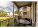 Screened balcony with table and chairs at 580 Brantley Terrace Way # 203, Altamonte Springs, FL 32714