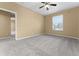 Spacious bedroom with large window and gray carpet at 580 Brantley Terrace Way # 203, Altamonte Springs, FL 32714