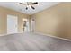 Well-lit bedroom featuring ceiling fan and ensuite bathroom at 580 Brantley Terrace Way # 203, Altamonte Springs, FL 32714