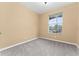 Spacious bedroom with large window and gray carpet at 580 Brantley Terrace Way # 203, Altamonte Springs, FL 32714