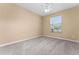 Bright bedroom featuring a ceiling fan and window at 580 Brantley Terrace Way # 203, Altamonte Springs, FL 32714