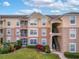 Building exterior showcasing a condo unit with balcony at 580 Brantley Terrace Way # 203, Altamonte Springs, FL 32714
