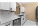 White cabinets, granite countertops and stainless steel appliances at 580 Brantley Terrace Way # 203, Altamonte Springs, FL 32714