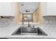 Kitchen sink and pass-through to the living room at 580 Brantley Terrace Way # 203, Altamonte Springs, FL 32714