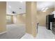 Open concept kitchen and living room with modern appliances and neutral colors at 580 Brantley Terrace Way # 203, Altamonte Springs, FL 32714