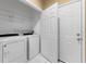 Laundry room with washer, dryer and storage at 580 Brantley Terrace Way # 203, Altamonte Springs, FL 32714
