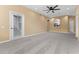 Living room with view into kitchen and access to balcony at 580 Brantley Terrace Way # 203, Altamonte Springs, FL 32714