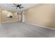Open living room with kitchen pass-through and neutral walls at 580 Brantley Terrace Way # 203, Altamonte Springs, FL 32714