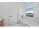 Relaxing bathroom with soaking tub and marble tile at 6491 Octave St, Mascotte, FL 34753