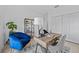 Home office with wood desk and comfortable armchairs at 6491 Octave St, Mascotte, FL 34753