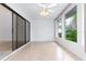 Bright sunroom with tile floors and sliding glass doors at 104 Coventry Ln, Haines City, FL 33844