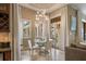 Bright breakfast nook with glass table and seating for four at 11103 Bridge House Rd, Windermere, FL 34786