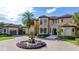 Grand estate with circular driveway and beautiful landscaping at 11103 Bridge House Rd, Windermere, FL 34786