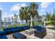 Spacious patio with fire pit, comfortable seating, and stunning lake view at 11103 Bridge House Rd, Windermere, FL 34786