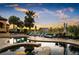 Inviting pool and spa area with lounge chairs and sunset view at 11103 Bridge House Rd, Windermere, FL 34786