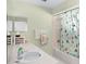 Bathroom with shower/tub combo and patterned curtain at 112 Blackwater Ct, Kissimmee, FL 34743