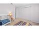 Bedroom with crib and sliding door closet at 112 Blackwater Ct, Kissimmee, FL 34743