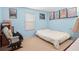 Light blue bedroom with a double bed at 112 Blackwater Ct, Kissimmee, FL 34743