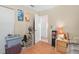 Bedroom with wood floors and built-in shelving at 112 Blackwater Ct, Kissimmee, FL 34743