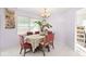 Charming dining room with table, chairs and a plant at 112 Blackwater Ct, Kissimmee, FL 34743