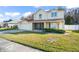 Two-story house with a front yard and attached garage at 112 Blackwater Ct, Kissimmee, FL 34743