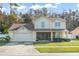 Two-story house, attached garage, front yard at 112 Blackwater Ct, Kissimmee, FL 34743