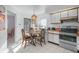 Kitchen with breakfast nook and view into dining area at 112 Blackwater Ct, Kissimmee, FL 34743