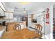 Eat-in kitchen with wood cabinets and view to living area at 112 Blackwater Ct, Kissimmee, FL 34743