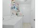 Clean laundry room, washer, dryer and shelving at 112 Blackwater Ct, Kissimmee, FL 34743