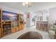 Open living room with kitchen view and breakfast bar at 112 Blackwater Ct, Kissimmee, FL 34743