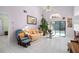 Relaxing living room with rocking chair and view of pool at 112 Blackwater Ct, Kissimmee, FL 34743