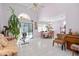 Living room with vaulted ceilings, a sofa and access to pool at 112 Blackwater Ct, Kissimmee, FL 34743